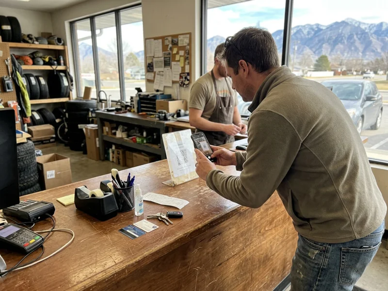 Customer scanning a review QR card at the counter