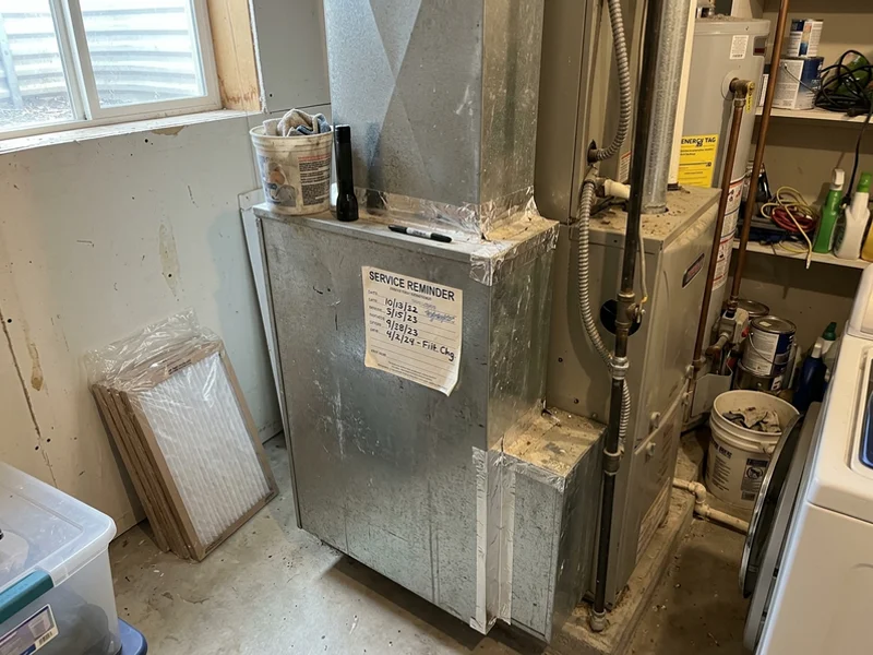 Service reminder label on a furnace cabinet