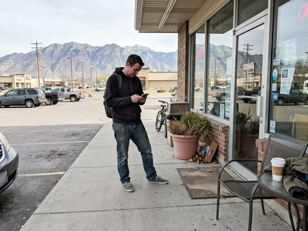 Customer checking a business profile on a phone