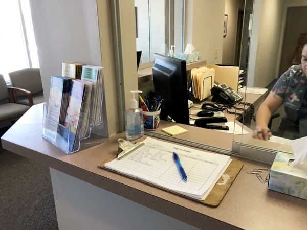 Service brochures at a dental front desk
