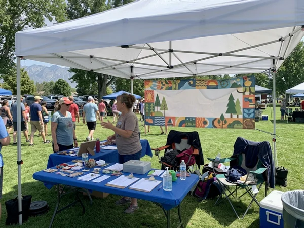 Event banner behind a vendor booth