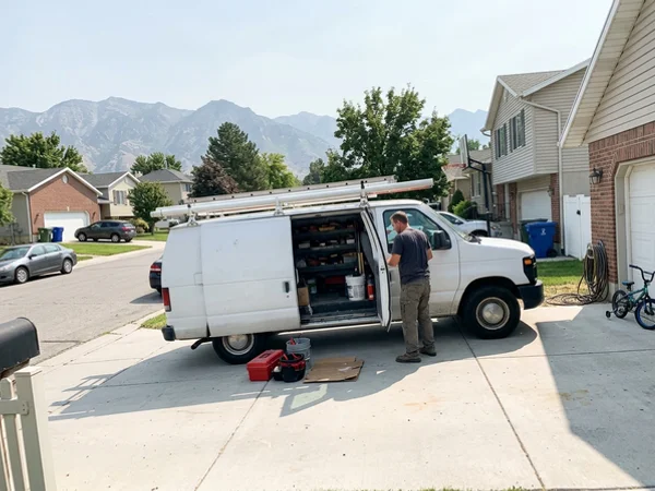 Mobile service van in a residential driveway