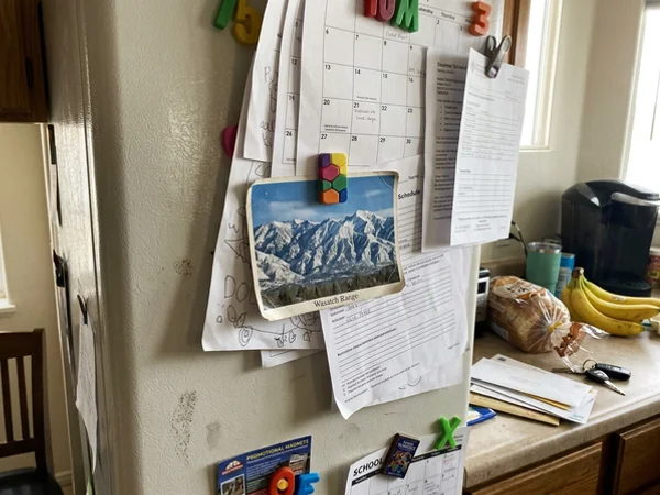 Community Postcard pinned to a fridge