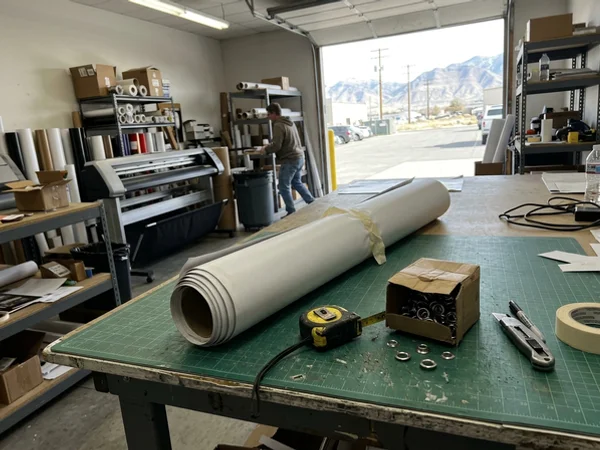Rolled banner on a print shop table