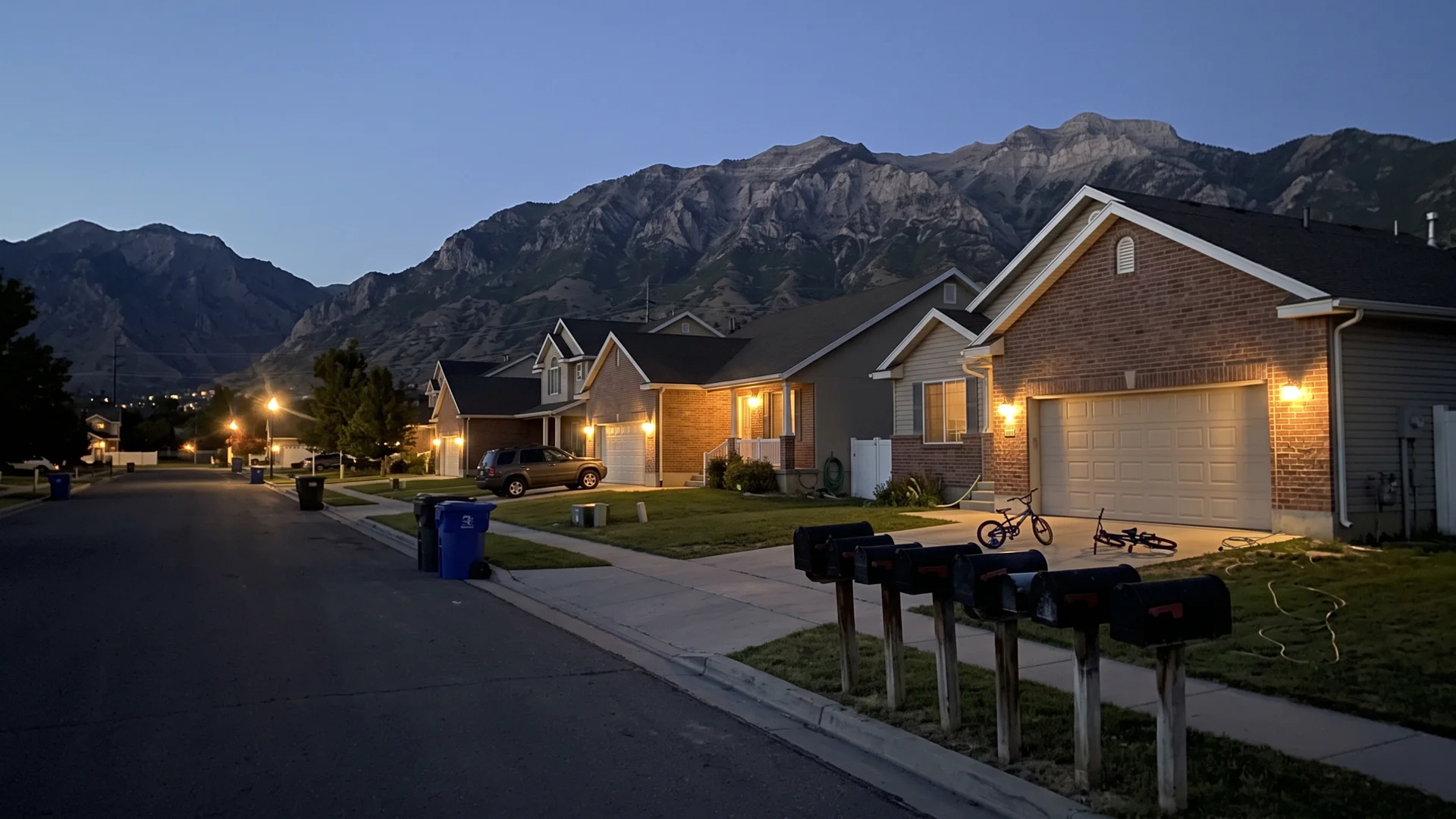 Salt Lake Valley neighborhood at dusk with curbside mailboxes