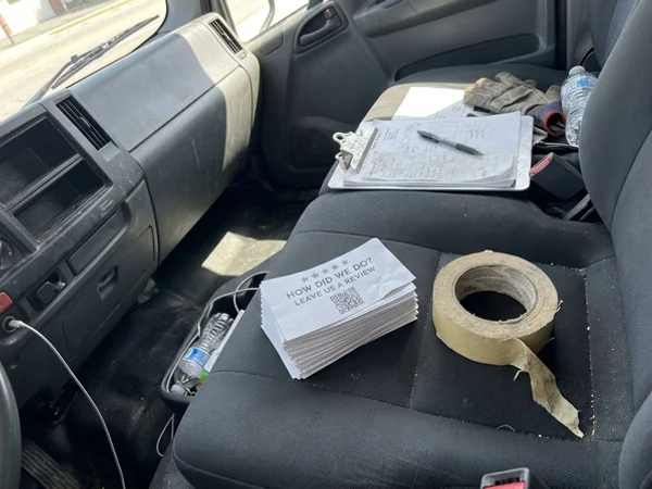 Leave-behind review cards in a work truck